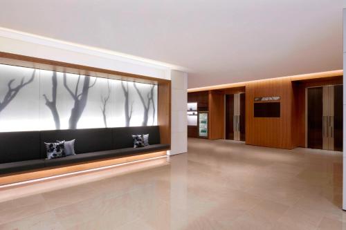 a hallway with a large window with trees on it at Courtyard by Marriott Seoul Botanic Park in Seoul
