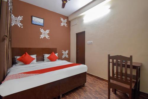 a bedroom with a bed with snowflakes on the wall at OYO Hotel Shiv Shakti in Jaipur