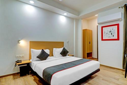 a bedroom with a large bed in a room at Townhouse Sector Near Botanic Garden of Indian Republic in Noida