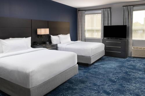 A bed or beds in a room at Residence Inn by Marriott Manchester Downtown