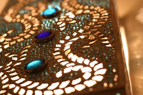 a close up of a table with beads on it at SpoonDrift Hostal Kenting in Nanwan