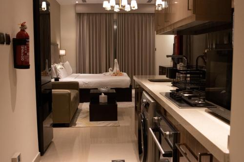 a kitchen with a room with a bed in it at Elite Downtown Residences - Paradise View in Dubai