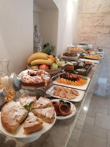 a buffet of different types of food on a table at Masserie Maresca in Ostuni