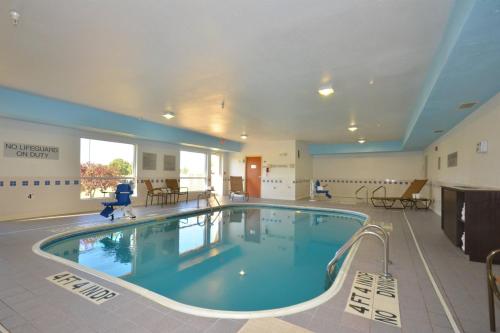 a large swimming pool in a large room at Freedom Inn in Springfield
