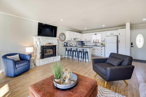 a living room with a couch and chairs and a fireplace at Deck, Fire Pit and Grill Lakefront Oklahoma Abode in Jay