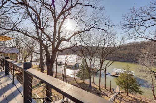a view of a river from the balcony of a house at Deck, Fire Pit and Grill Lakefront Oklahoma Abode in Jay