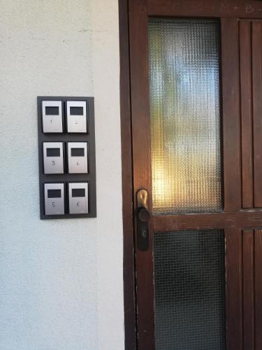 a door with a light switch on a wall at Alte Innbrücke in Schärding