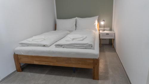 Ένα ή περισσότερα κρεβάτια σε δωμάτιο στο homy City Diamant in Feldkirch, Grenznähe und doch Zentral