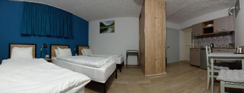 Una cama o camas en una habitación de Apart-hotel TARHUN