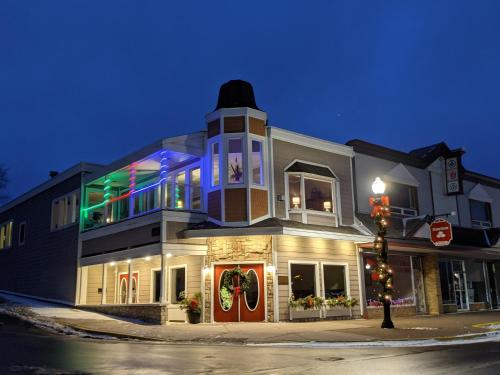 a building on the corner of a street at night at Pier Harbor #2 in Saint Ignace