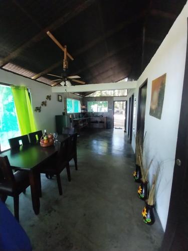 a dining room with a table and chairs at Happy Monkeys in Puerto Jiménez