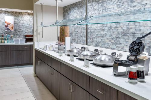 a kitchen with a counter with pots and pans at Residence Inn Tampa Downtown in Tampa