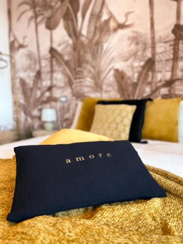 a blue napkin sitting on top of a bed at ORODIMORA Milano in Milan
