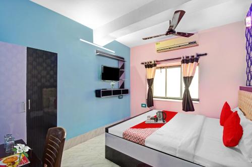 Postel nebo postele na pokoji v ubytování Hotel O Ankan Regency Near Acropolis Mall