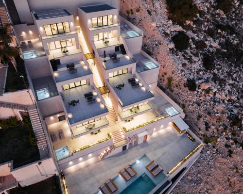 an overhead view of a building with a swimming pool at Saronida Hills in Saronida