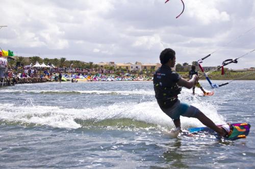 a man is on a board in the water at Resort Santa Maria Hotel in Birgi Vecchi