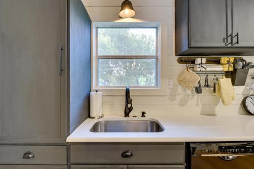 a kitchen with a sink and a window at Dog-Friendly Midlothian Home with Yard, Fire Pit! in Midlothian