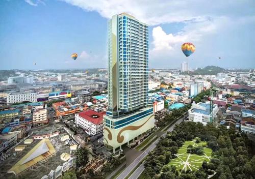 a city with hot air balloons in the sky at 12-10 Twin bedroom in Formosa Residence Nagoya Batam 3 pax by Wiwi in Nagoya