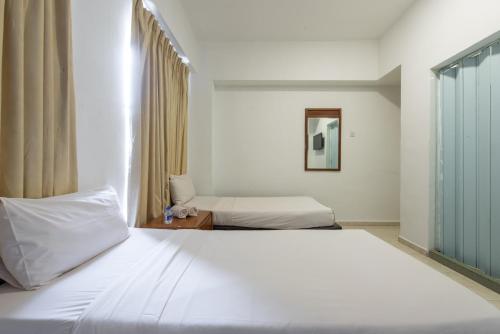 Voodi või voodid majutusasutuse Hollitel Hotel toas