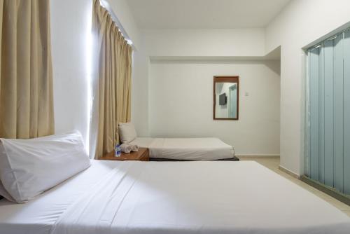Postel nebo postele na pokoji v ubytování Hollitel Hotel
