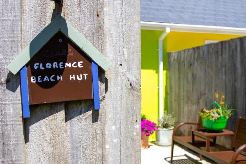 a sign on the side of a house that reads bounce beach hut at Krissie's in Marazion