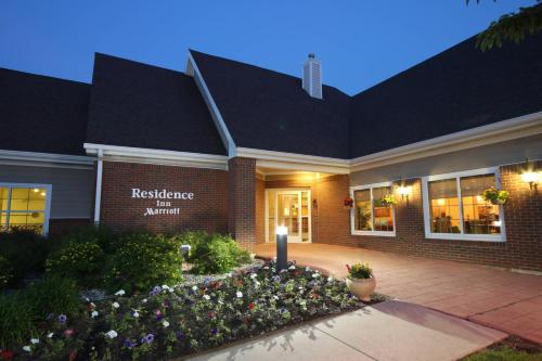 a brick building with a sign for theresidence inn at night at Residence Inn by Marriott Chicago / Bloomingdale in Bloomingdale