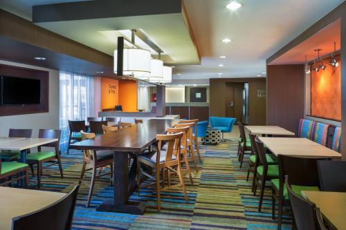 a large dining room with tables and chairs at Fairfield Inn & Suites by Marriott San Antonio Airport/North Star Mall in San Antonio