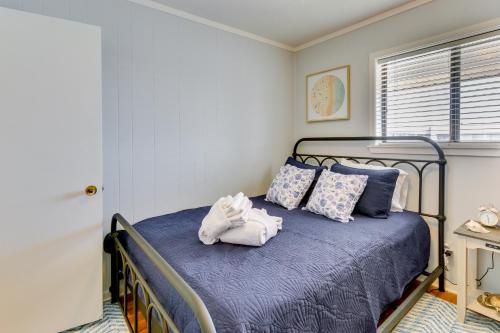 a bedroom with a bed with towel animals on it at Walk to Beach Hilton Head Condo with Golf Views in Hilton Head Island