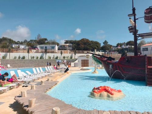 a water park with a pirate ship in the water at Camping Saint Georges d'Oléron in Saint-Georges-dʼOléron