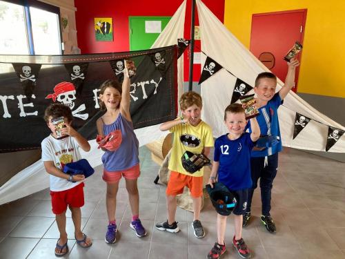 a group of children posing for a picture in a room at Camping Saint Georges d'Oléron in Saint-Georges-dʼOléron