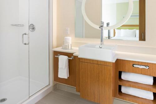 a bathroom with a sink and a shower at SpringHill Suites by Marriott Philadelphia Langhorne in Langhorne