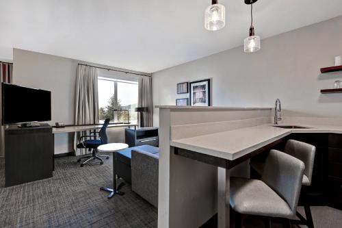 an office with a desk with a computer and chairs at Residence Inn Steamboat Springs in Steamboat Springs