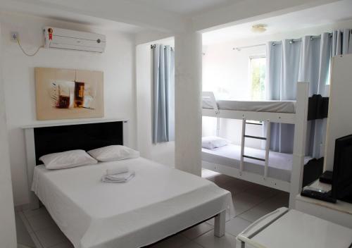 Postel nebo postele na pokoji v ubytování Hotel Pousada Oasis