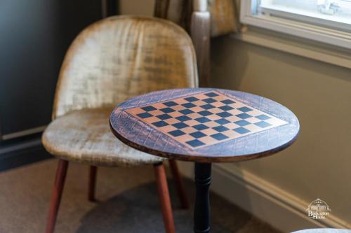 a chess board on a table on a chair at Burlington House Boutique in Oxford