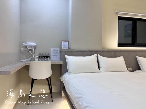 a bedroom with a bed and a phone on a counter at Ocean Nap Island Stay in Magong