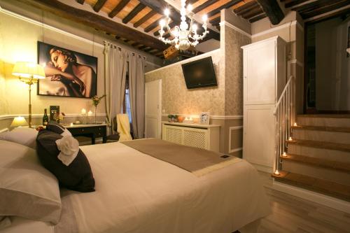 Säng eller sängar i ett rum på San Michele al Borgo