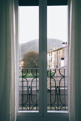 an open window with a view of a city at Casa Montero in Viniegra de Abajo