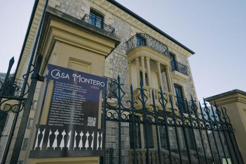 a building with a fence in front of it at Casa Montero in Viniegra de Abajo