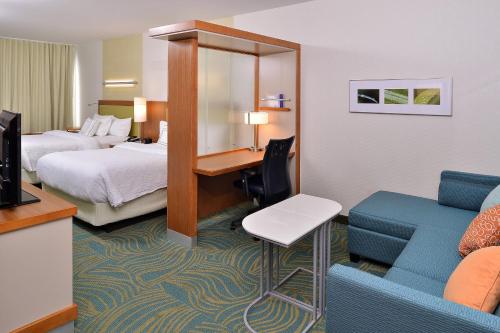 a hotel room with a bed and a desk and a couch at SpringHill Suites by Marriott Voorhees Mt. Laurel/Cherry Hill in Voorhees