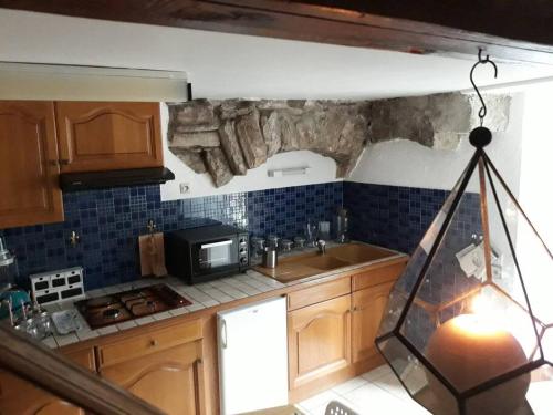 Kuchyň nebo kuchyňský kout v ubytování Ste ENIMIE GITE terrasse privative vue imprenable