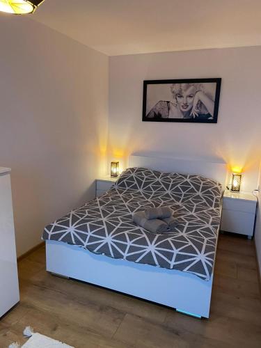 a bedroom with a bed and two night stands at LUXURY GOLD APARTMENT by Marta in Radom
