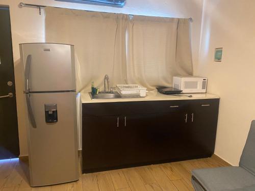 Kuhinja oz. manjša kuhinja v nastanitvi Suites Fenicia