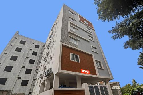 a tall building with a soo sign on it at Super Hotel O Qualia Pride Financial District in Hyderabad