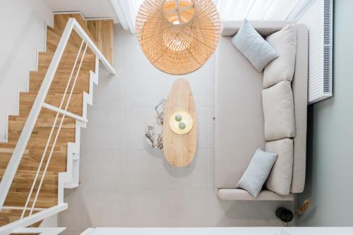 a living room with a surfboard on the wall at ESTEA Quality Living in Volos