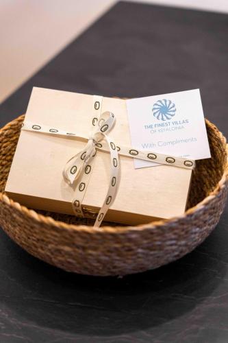 a basket filled with boxes sitting on top of a table at Grouzi Loft in Skala Kefalonias