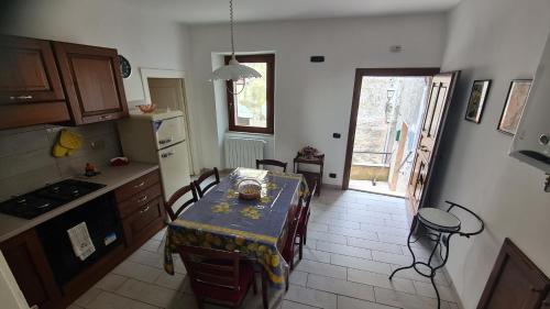 a kitchen with a table and chairs and a table and a table and a kitchen at Amazing Lake View in Castel di Tora