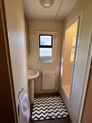 a small bathroom with a toilet and a sink at welcome to B4 in Aberystwyth