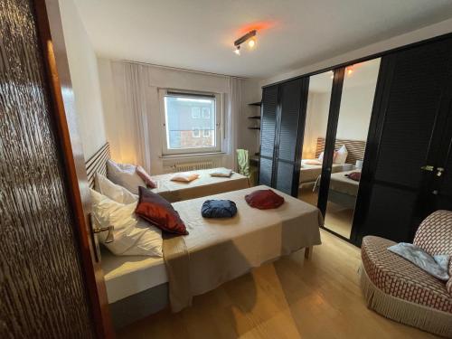 a hotel room with a bed and a window at Relax Center Suite in Essen
