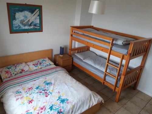 a bedroom with two bunk beds and a bed at Atlantic View in Bundoran