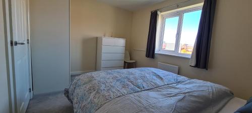 a bedroom with a bed and a window at Wishart Drive in Curborough